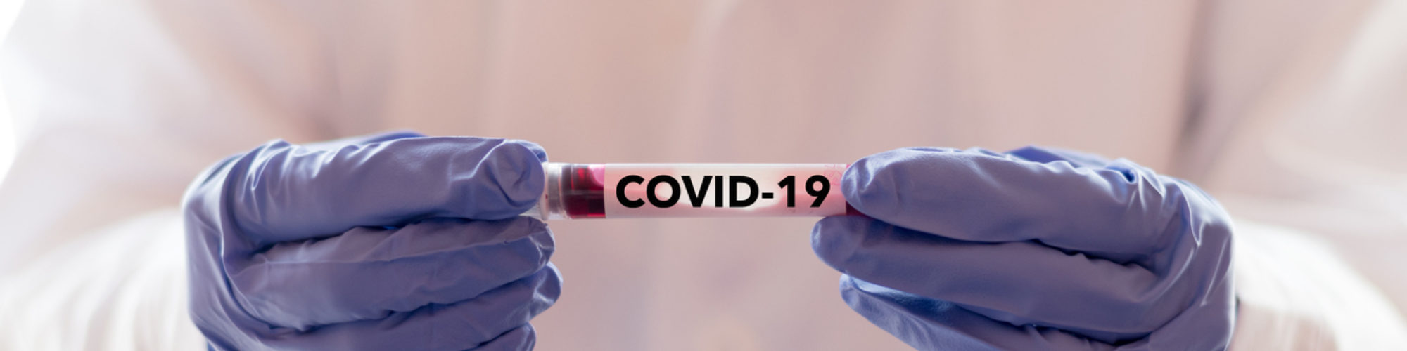 COVID-19 named by WHO for Novel coronavirus NCP concept. Doctor or lab technician holding blood sample with novel (new) coronavirus N.C.P. in Wuhan, Hubei Province, China, medical and healthcare